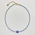 Close-up detail of the Evil Eye beaded necklace featuring colorful mixed seed beads - Style O / One Size / 38+5cm / Multicolor Mix