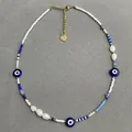 Handgemaakte evil eye kralenketting met witte zaadkralen en parels, boheemse stijl - Stijl A / Eén maat / 38+5cm / Blauw