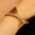 Close-up view of a bold gold-toned twisted metal cuff bracelet in punk hip-hop style - Multi-Layer Twisted Style Bracelet (Glossy Gold) / Gold