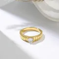 Detail view showing the vertical grooved gold band and square-cut clear center stone - US 7 / Gold White Rhinestone