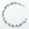 Detailed view of the elegant blue crystal leaf and petal design on a silver-toned bracelet - Silver Sky Blue Zirconia Tulip