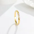 Detail view of gold-plated titanium steel ring with three clear cubic zirconia inlays - US 7 / White Zirconia (A250) - Gold