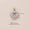 Oval stainless steel pendant charm featuring blue checkered pattern and red bow motif - Light Blue Bow Pendant