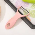 Professioneller ergonomischer rosa Keramikschäler für effizientes Schälen von Obst - Edelstahl-Stil / Nordisches Rosa