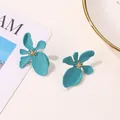 Exaggerated matte turquoise lacquer flower earrings with gold textured center for party - Dark Green