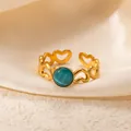 Elegant gold heart ring with teal gemstone, vintage adjustable stainless steel design. - Openwork Heart Cyan Stone Adjustable Style (TYR1021)