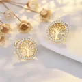 Detailed shot of gold tree of life stud earrings with sparkling cubic zirconia pavé - Gold