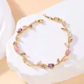 Vintage gold tone bracelet with purple and pink crystal flower and leaf design for women - Gold And Purple