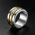 Close-up of 12mm titanium steel spinner ring with gold band on black leather. - Size 7 / Rotatable Grooved Style / Gold