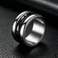 Close-up of 12mm wide titanium steel ring with a rotatable black center band detail - Size 7 / Rotatable Grooved Style / Black