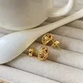 Elegant 18K gold-plated woven mesh ball stud earrings on a textured jewelry tray - Woven Ball Style (A0105C) / S / Gold