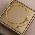 Elegante goldfarbene geflochtene Titanstahl-Fußkette mit verstellbarer Kette. - Gold Sternenhimmel Fußkettchen