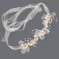 Elegant white ribbon wrist corsage with artificial pearls and floral details for weddings. - Gold Flower & Pearl Bracelets