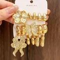 Set aus klobigen goldenen geometrischen Ohrringen mit Blumen- und Creolen-Designs - 3er Karten-Set (ca. 9 Paare) / Gold