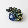 Detailed view of a peacock-shaped hair claw clip made of marbled acetate material. - Classic Peacock (4#)