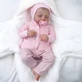 Realistic 19-inch reborn baby doll sleeping in a plush star-shaped swaddle blanket - Full Vinyl Body / Pink 3-Piece Set