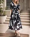 Elegant V-neck waist-slimming long dress featuring black and white geometric print - S / Patterned Black