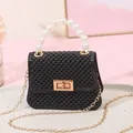 Mini black jelly handbag featuring a pearl beaded handle and a elegant gold chain strap - Black