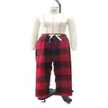 Front view of red and black buffalo plaid pajama pants on a mannequin torso - S / Bottoms / Red and Black Grid