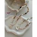 Detailed macro view of handmade shell and pearl beaded necklace for summer beach vacation style - Starfish Seed Bead Artificial Pearl Style (45+5cm)