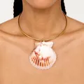 Detailed view of a natural scallop shell pendant on a gold-plated torque necklace. - Rigid Collar Shell Necklace (25B8) / One Size / Gold