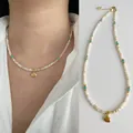 Summer beach style beaded necklace with natural stones, pearls and a golden shell pendant - One Size / Metallic Shell (38+5cm)