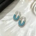 Elegant U-shaped silver hoop earrings featuring pavé-set turquoise stones on shell background - Silver Blue Turquoise U-Shape Clip Style (E3188) / Silver