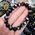 Detaillierte Nahaufnahme eines natürlichen Silber-Obsidian-Armbands mit Katzenaugeneffekt - Stufe 1