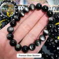 Primer plano detallado de pulsera de obsidiana plateada natural con efecto ojo de gato - Bucle Único (Aprox. 23 Cuentas) / 8mm / Grado 1