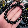Detailaufnahme eines Armbands aus natürlichem Silber-Obsidian mit Katzenaugeneffekt - Klasse 2 Doppelauge