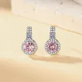 Macro view of elegant pink zircon stud earrings featuring a sparkling crystal halo - Stud Earrings (1 Pair) / Silver (Pink Zirconia)