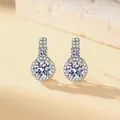 Elegant silver-tone cubic zirconia halo stud earrings with brilliant round-cut central stone - Stud Earrings (1 Pair) / Silver (White Zirconia)