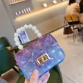 Detailed close-up showing the transparent purple PVC material and pearl handle of the jelly bag. - Transparent Purple
