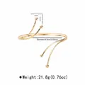 Bracelet de bras doré multicouche géométrique avec extrémités en goutte et mesures - B3728