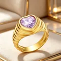 Elegant 18K gold plated stainless steel ring with purple heart gemstone and wavy band - Size 7 / Gold with Purple Zircon