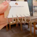 Minimalistische zilverkleurige creolen set op een witte kaart - Metalen Ring Stijl (Nr. 8) / 3 paar set / Zilver
