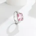 Detailed macro view of a polished silver titanium steel ring with a rectangular pink gem - Pink (Silver Tone)