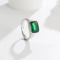 Close-up of elegant silver-toned ring with large emerald-green square gemstone - Green (Silver Tone)