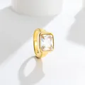Close-up of elegant gold-toned titanium steel ring with large rectangular clear gemstone - Size 7 / 方钻款式(C307) / White (Gold Tone)