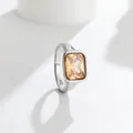 Close-up detail of an elegant silver ring featuring a large rectangular champagne gemstone. - Champagne (Silver Tone)