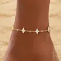 Elegant gold plated stainless steel anklet featuring delicate white flower charms on sand - Gold Single Layer Clover Anklet