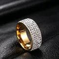 Detailed close-up of a gold titanium steel ring with five rows of sparkling rhinestones - Size 7 / 8mm Full Rhinestone Style / Gold