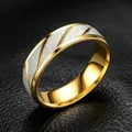 Macro detail of 8mm two-tone stainless steel men's ring with brushed texture - Size 7 / 6mm / Gold