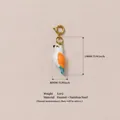 Pendentif oiseau en émail peint à la main en acier inoxydable plaqué or 18 carats - Oiseau Blanc