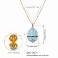 Light blue egg locket necklace with inner flower pendant in gold-plated copper - November Flower