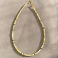Detail view of handmade faceted yellow natural stone necklace with gold beads - Necklace / 38+5cm / Yellow-Green