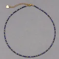 Elegant faceted natural blue stone beaded necklace with gold spacers and heart charm - Necklace / 38+5cm / Lapis Lazuli and Gold