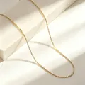 Close-up of a delicate gold-toned O-chain necklace made of durable stainless steel - 40+5cm / O Chain / Gold
