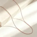 Close-up of a delicate rose gold titanium steel O-chain necklace with a soft glow - 40+5cm / O Chain / Rose Gold