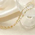 Close-up detail of a minimalist gold star-patterned stainless steel necklace chain. - 40+5cm / Lips Chain / Gold